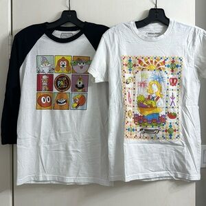 Two XS Meow Wolf shirts